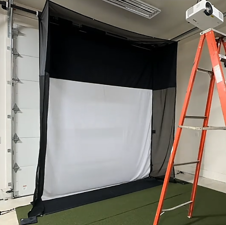 G-Trak retractable golf screen mounted on garage door tracks