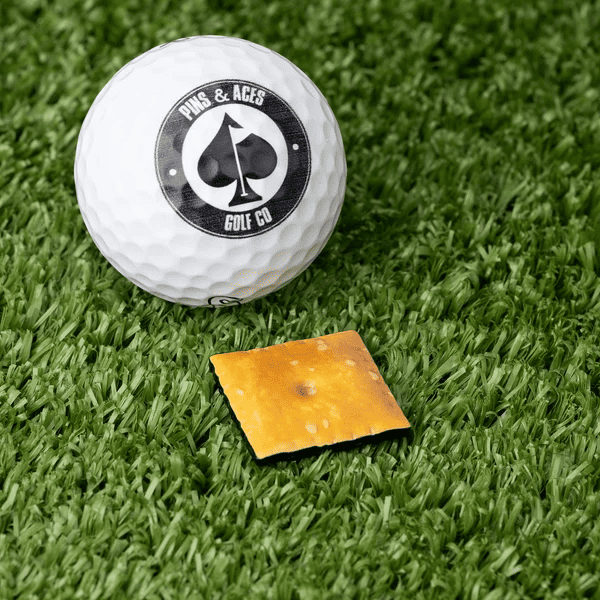 Pins and Aces cracker ball marker, one of the best gifts for golfers under $50