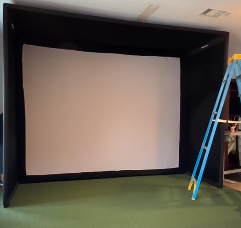 SIG10 golf simulator enclosure fully assembled with impact screen
