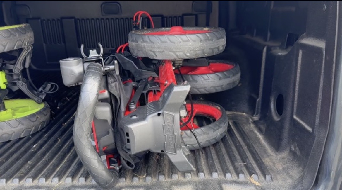 Bag Boy Nitron push cart folded in a truck bed